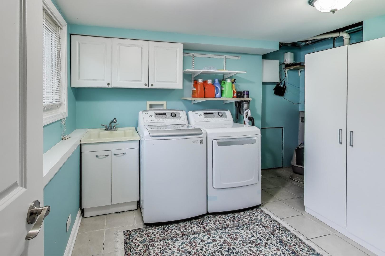 396 Stone Place Wheeling, IL 60090 - Photo 21 of 28 a utility room with dryer and washer