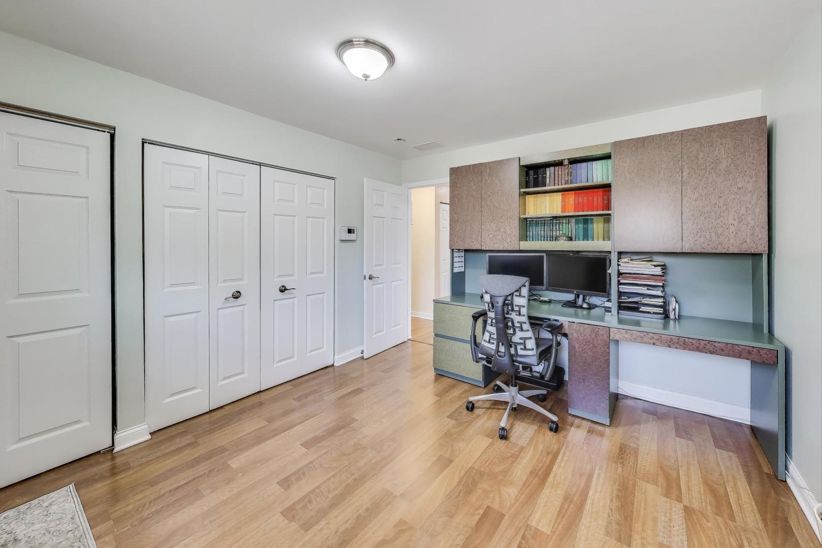 396 Stone Place Wheeling, IL 60090 - Photo 9 of 28 a living room with furniture and a flat screen tv