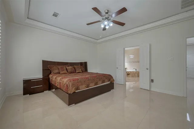 a view of a livingroom with furniture and a flat screen tv