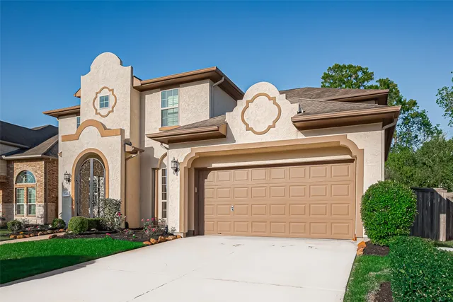 a view of a dining room with furniture and a potted plant