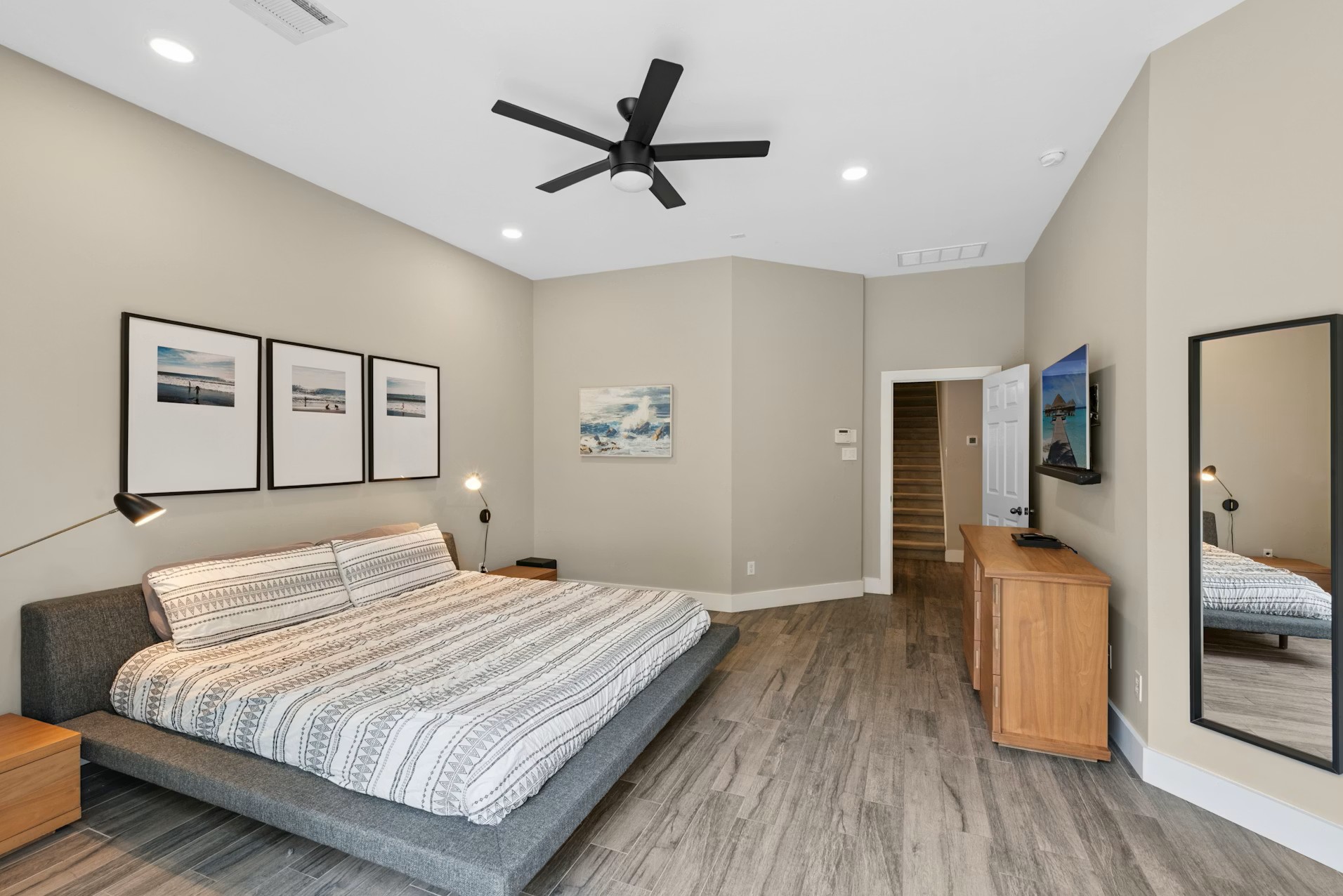 320 El Socorro Lane Austin, TX 78732 - Photo 22 of 40 a bedroom with a bed and wooden floor