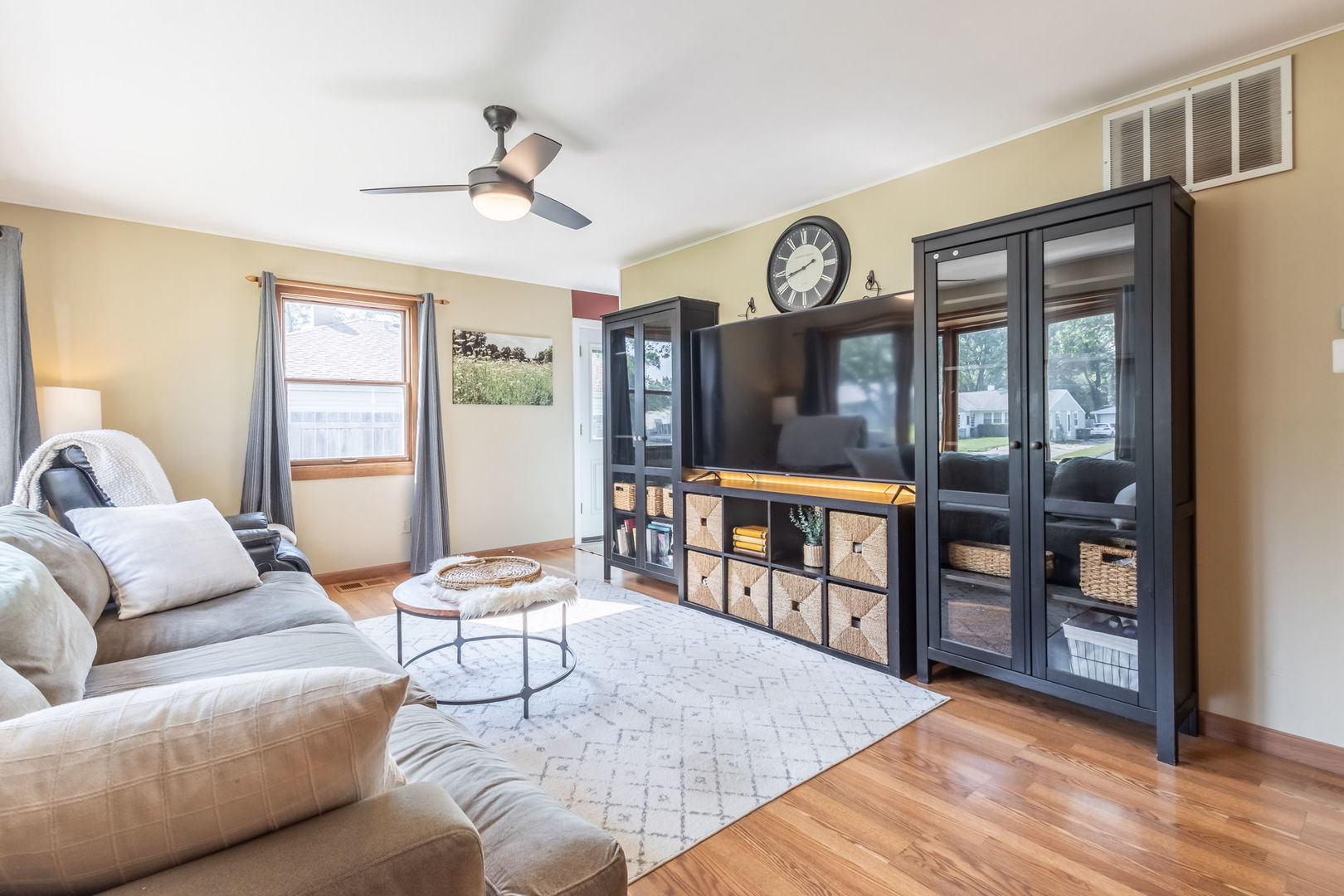 2802 Campbell Street Rolling Meadows, IL 60008 - Photo 2 of 27 a living room with furniture a window and a bookshelf
