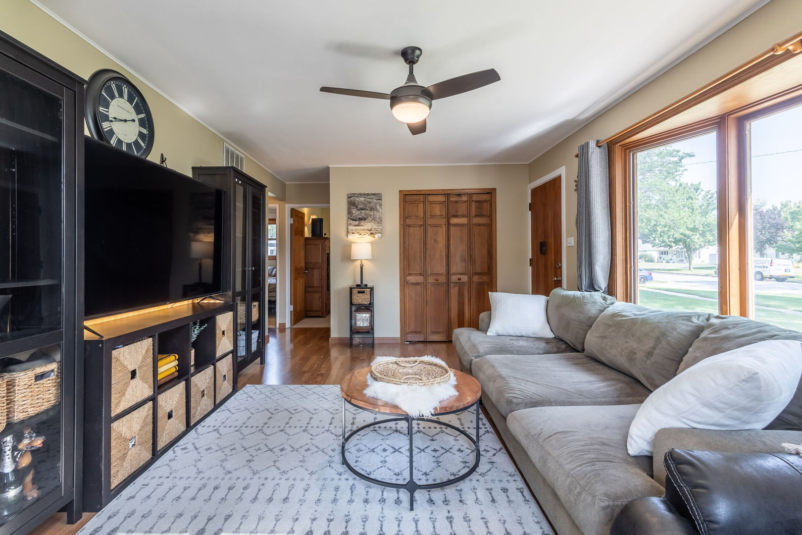 2802 Campbell Street Rolling Meadows, IL 60008 - Photo 4 of 27 a living room with furniture a flat screen tv and a large window