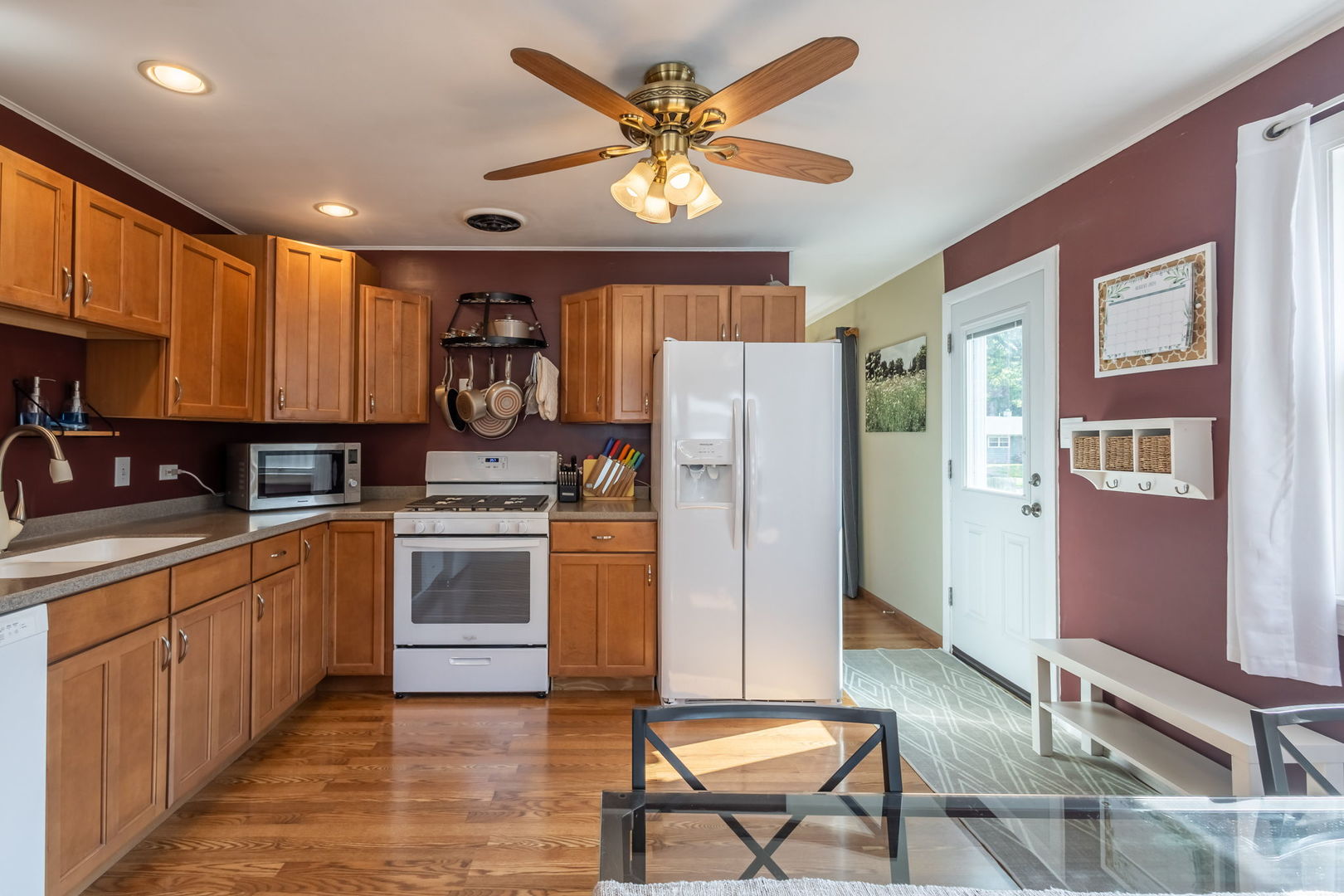 2802 Campbell Street Rolling Meadows, IL 60008 - Photo 7 of 27 a kitchen with stainless steel appliances granite countertop a refrigerator a sink dishwasher a stove and white countertops with wooden floor