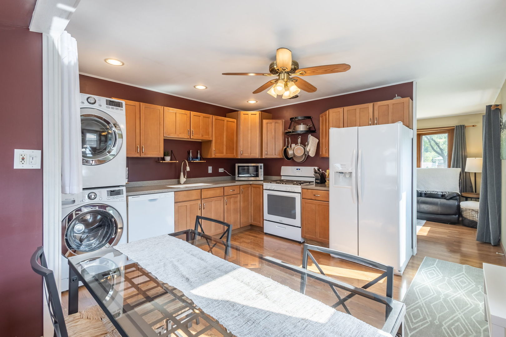 2802 Campbell Street Rolling Meadows, IL 60008 - Photo 8 of 27 a kitchen with granite countertop a refrigerator a stove a sink dishwasher and white cabinets with wooden floor