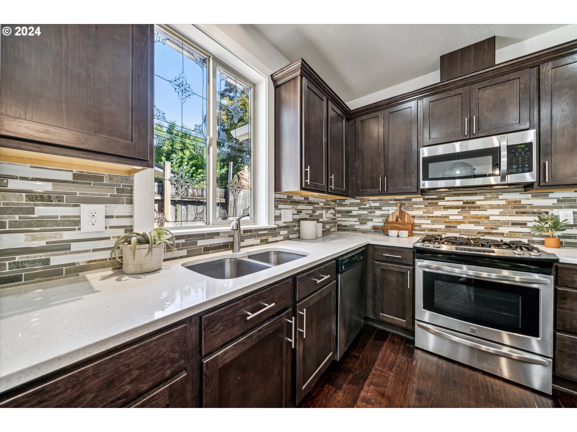 5731 Southeast Nehalem Street Portland, OR 97206 - Photo 12 of 21 a kitchen with a sink stove and microwave