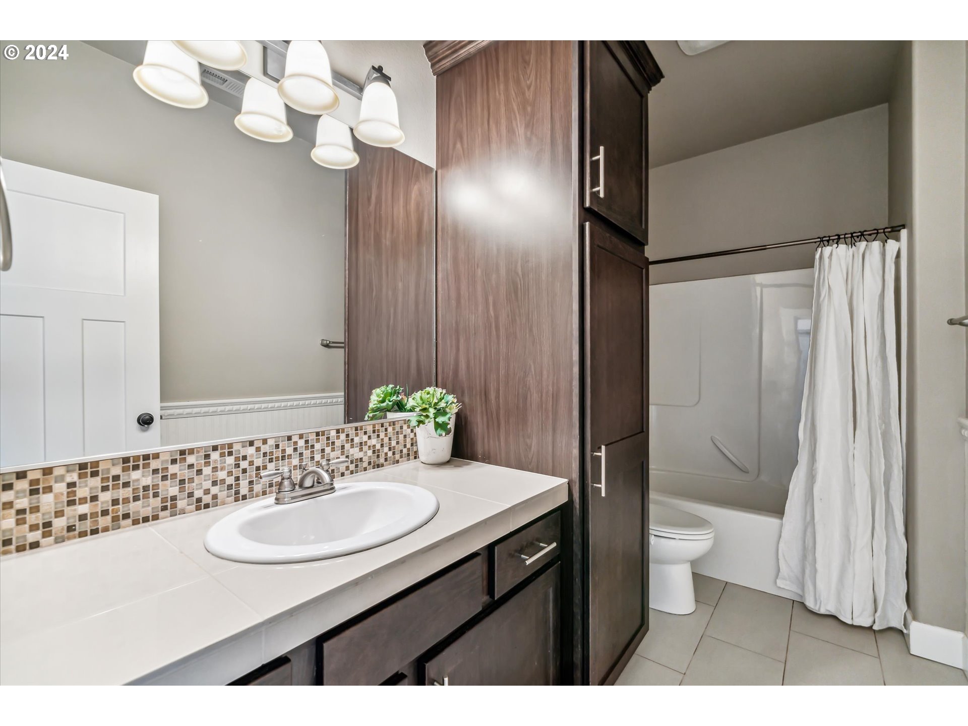5731 Southeast Nehalem Street Portland, OR 97206 - Photo 13 of 21 a bathroom with a sink a toilet and shower
