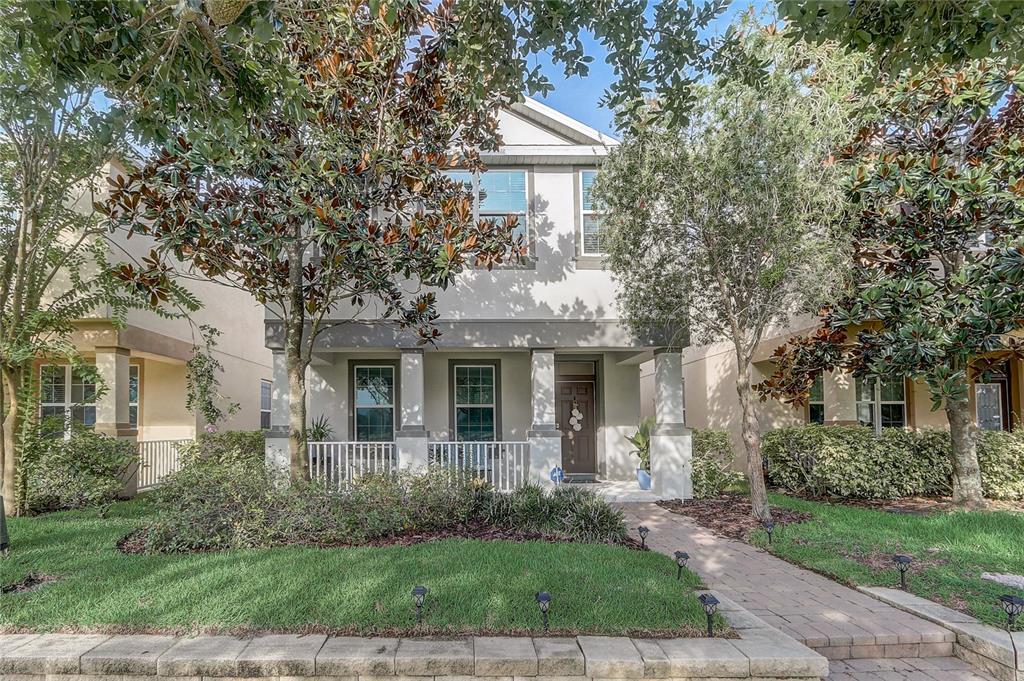a front view of a house with garden