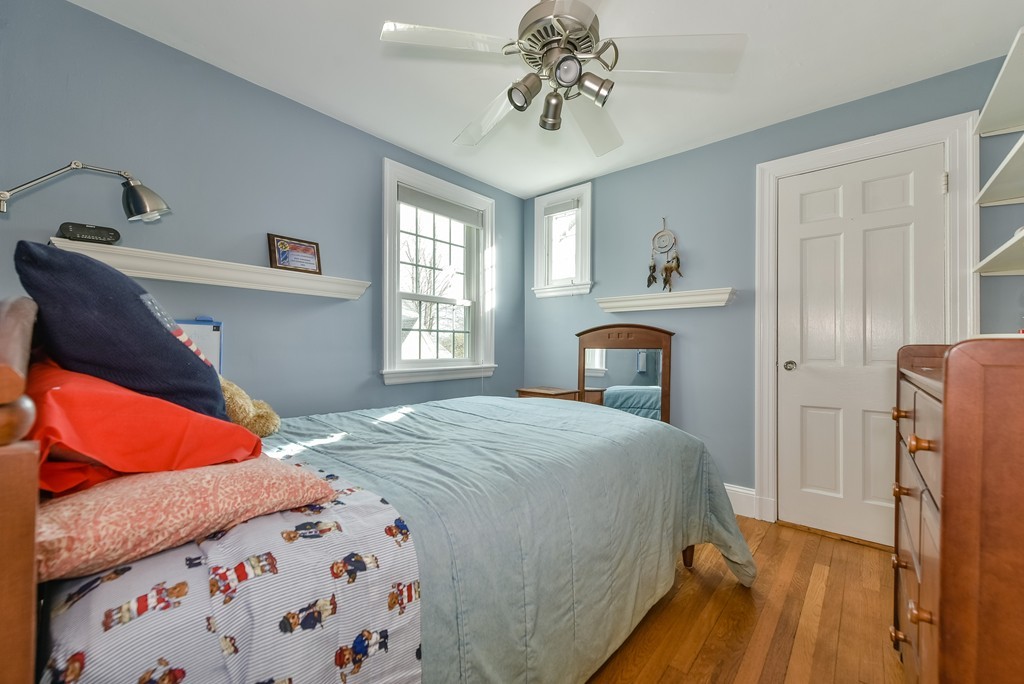118 Wolcott Road Brookline, MA 02467 - Photo 18 of 24 a bedroom with a bed and a fireplace