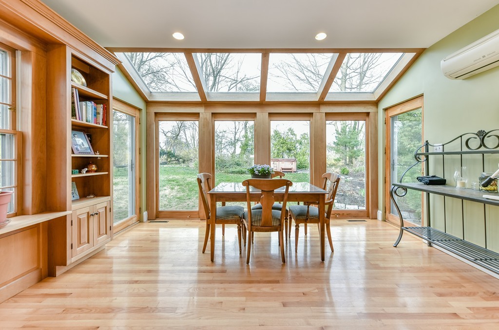 118 Wolcott Road Brookline, MA 02467 - Photo 2 of 24 a view of a dining room with furniture window and wooden floor