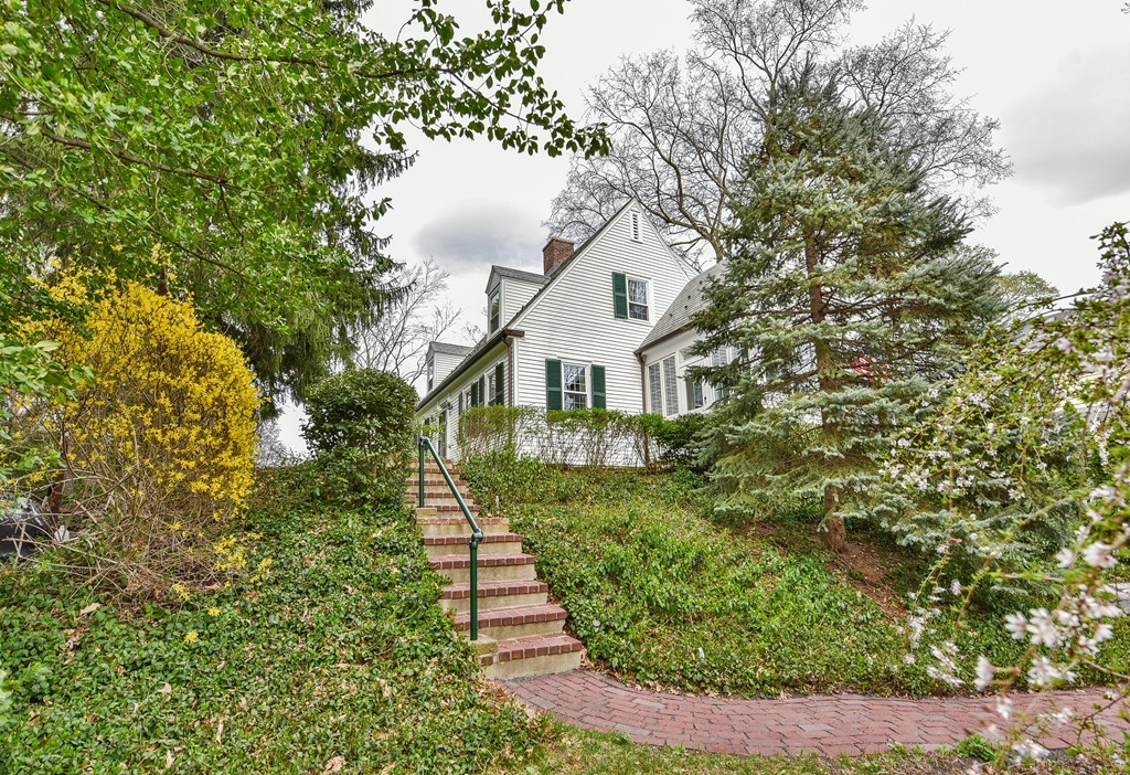 118 Wolcott Road Brookline, MA 02467 - Photo 23 of 24 a front view of a house with a yard