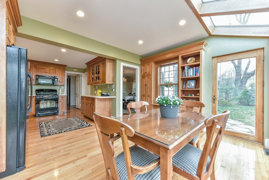 118 Wolcott Road Brookline, MA 02467 - Photo 4 of 24 a view of a dining room with furniture window and wooden floor