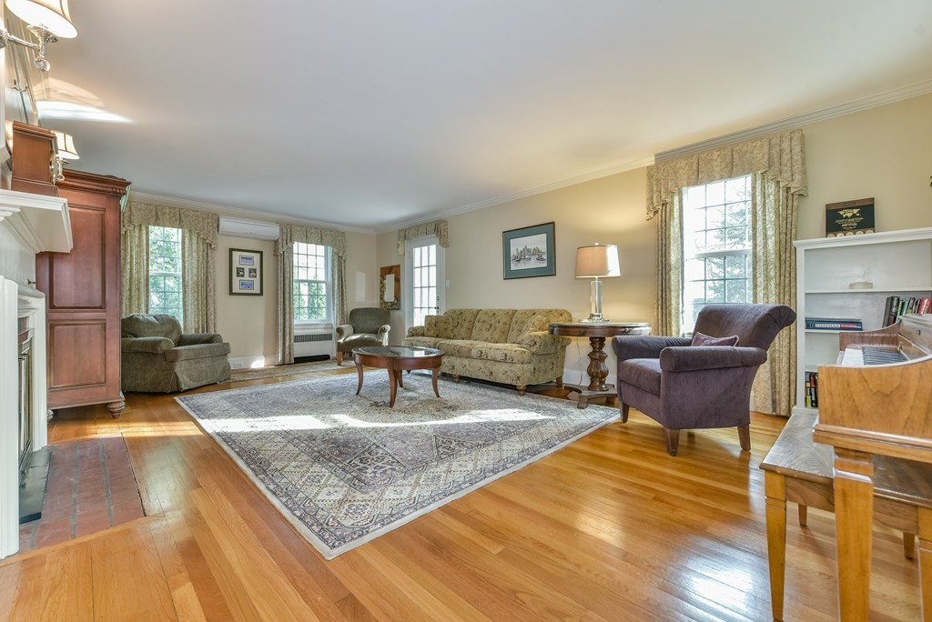 118 Wolcott Road Brookline, MA 02467 - Photo 8 of 24 a living room with furniture and a couch