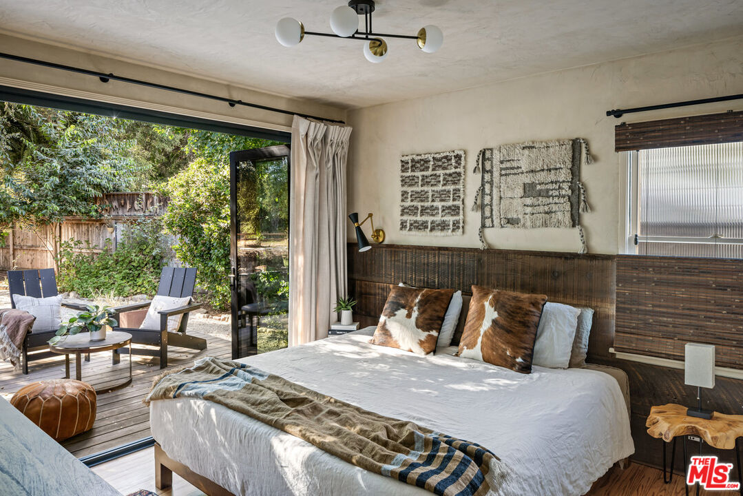 809 Drown Avenue Ojai, CA 93023 - Photo 8 of 24 a bedroom with a bed and glass window