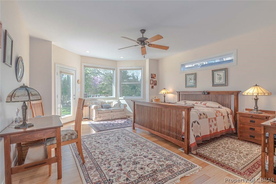 364 Captains Way Reedville, VA 22539 - Photo 34 of 50 1st Floor Primary waterfront ensuite bedroom - door to deck - customized closet - private full bathroom