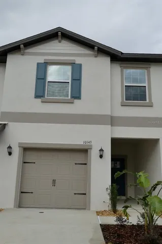 a house with a door and balcony view