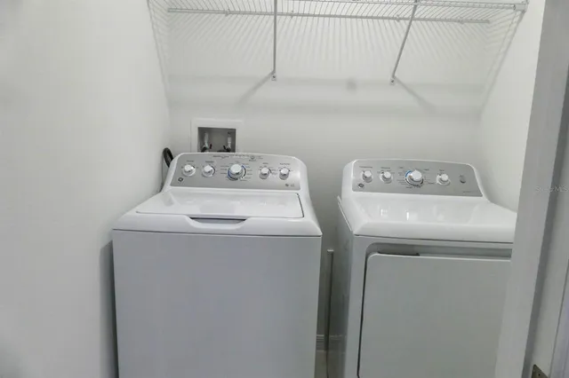 a utility room with dryer and washer