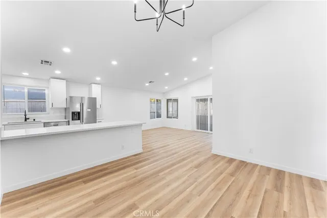 a view of kitchen with wooden floor and window