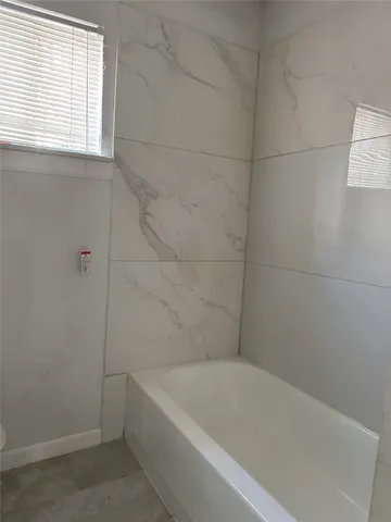 a bathroom with a bathtub