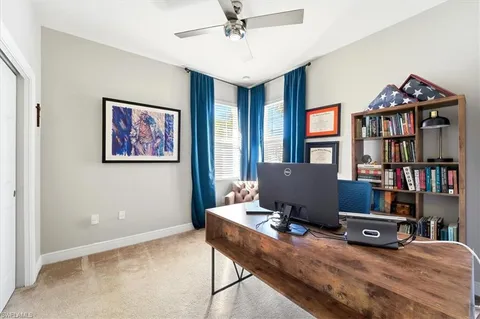 a workspace with furniture and book shelf