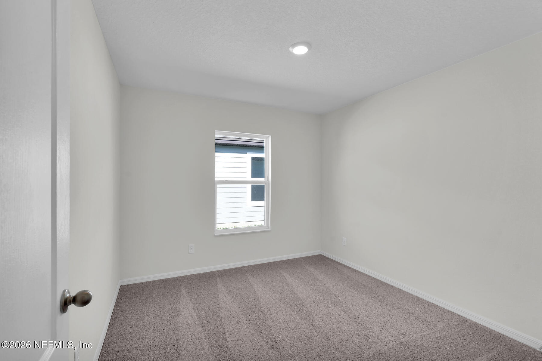 6949 Canoe Birch Road Jacksonville, FL 32219 - Photo 19 of 22 an empty room with a window