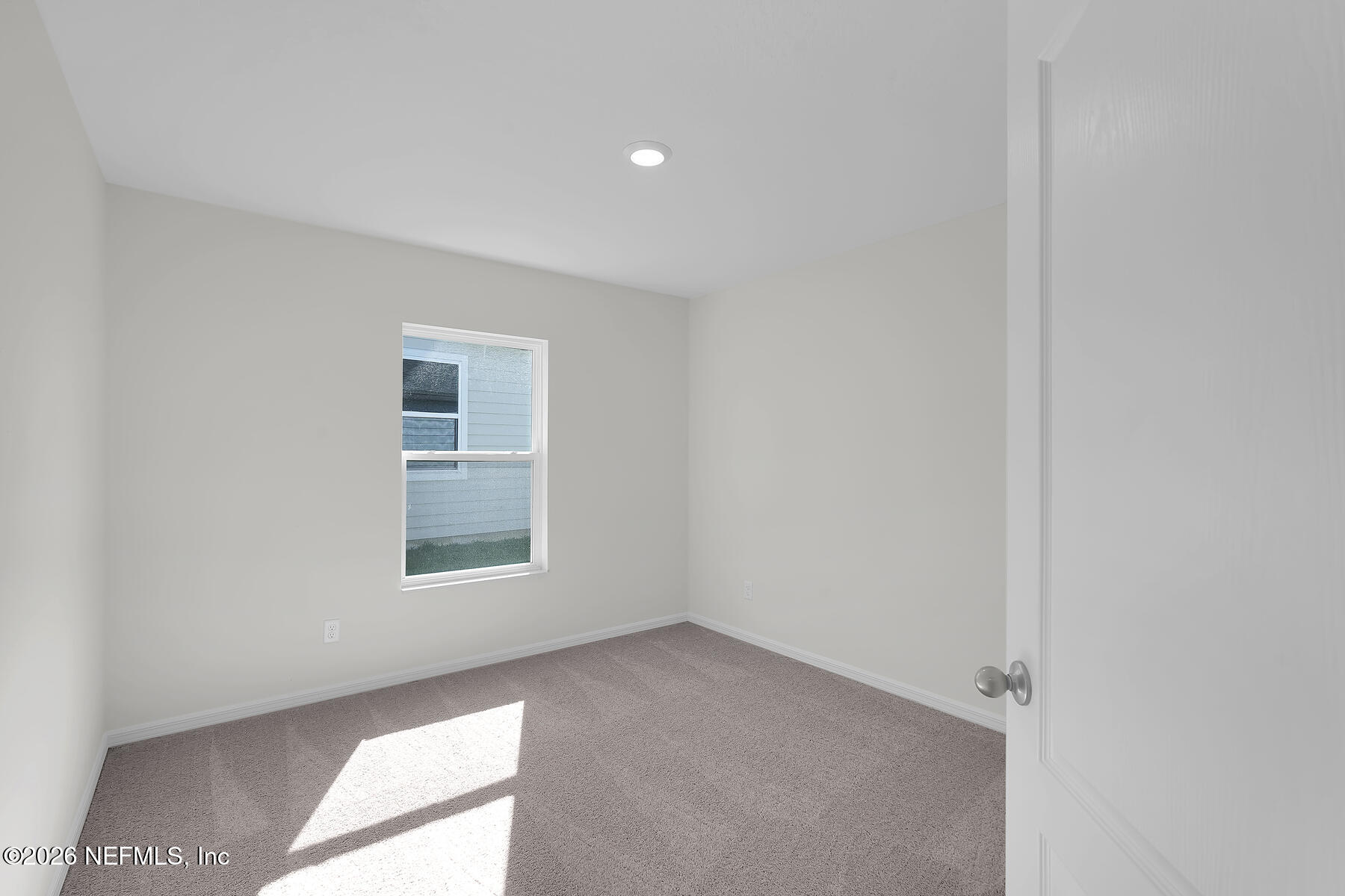 6949 Canoe Birch Road Jacksonville, FL 32219 - Photo 21 of 22 an empty room with a window
