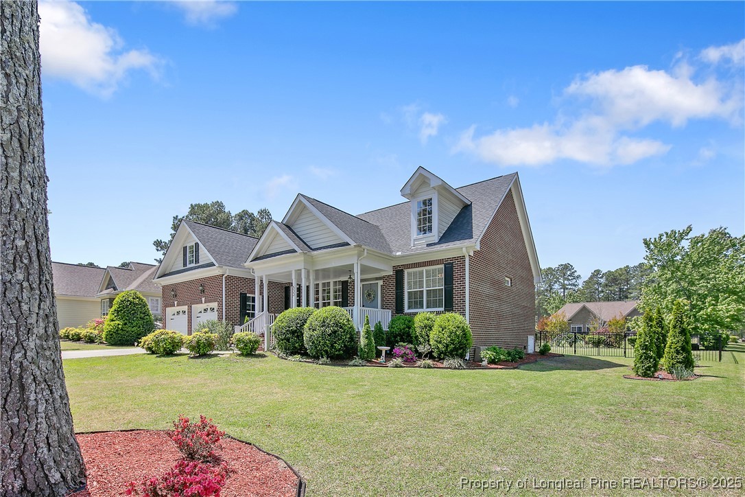533 Falling Water Road Spring Lake, NC 28390 - Photo 2 of 50 a front view of a house with garden