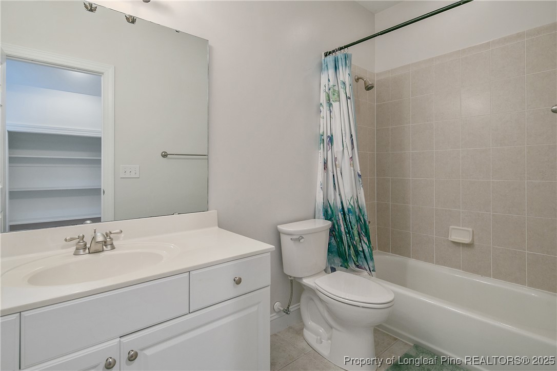 533 Falling Water Road Spring Lake, NC 28390 - Photo 44 of 50 a bathroom with a sink toilet and shower