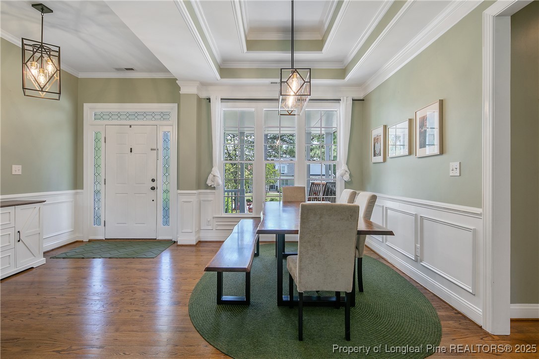 533 Falling Water Road Spring Lake, NC 28390 - Photo 8 of 50 a dining room with wooden floor and chandelier