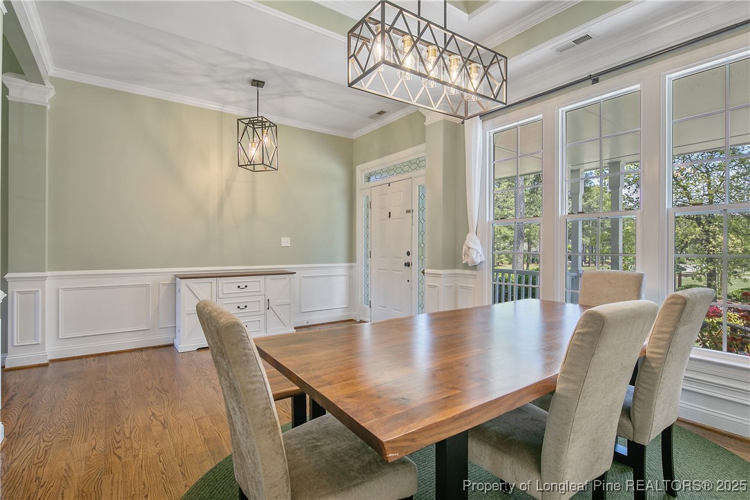 533 Falling Water Road Spring Lake, NC 28390 - Photo 9 of 50 a view of a dining room with furniture window and wooden floor