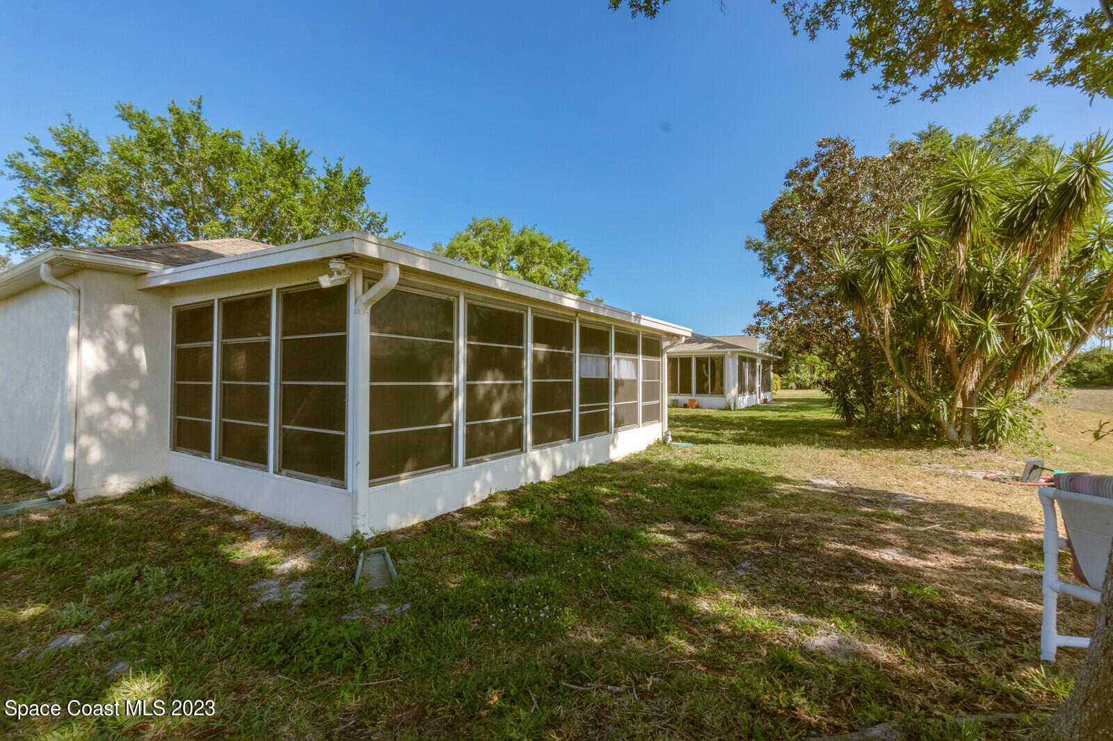 2154 Spring Creek Circle Palm Bay, FL 32905 - Photo 11 of 35 a view of a house with a yard
