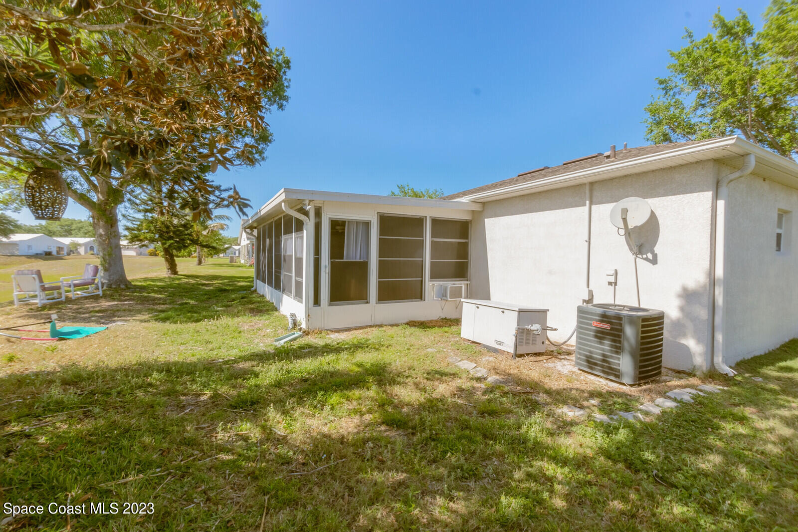2154 Spring Creek Circle Palm Bay, FL 32905 - Photo 12 of 35 a view of a house with backyard and porch