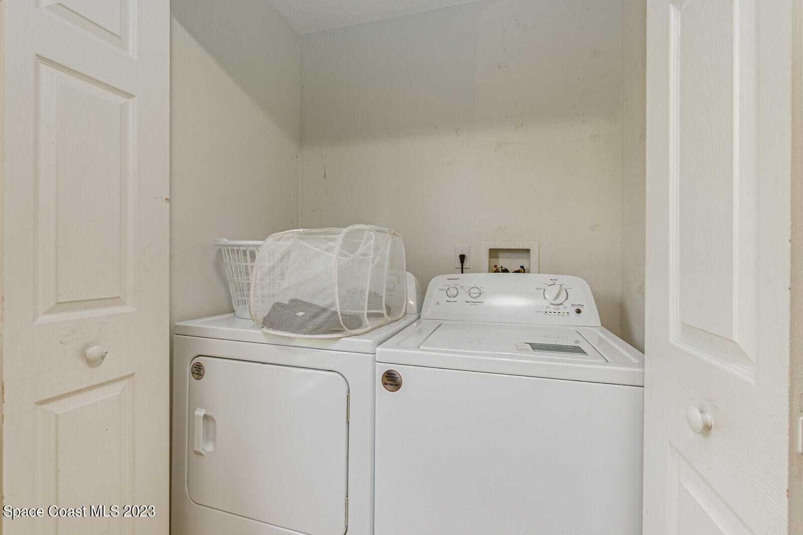 2154 Spring Creek Circle Palm Bay, FL 32905 - Photo 18 of 35 a utility room with dryer and washer