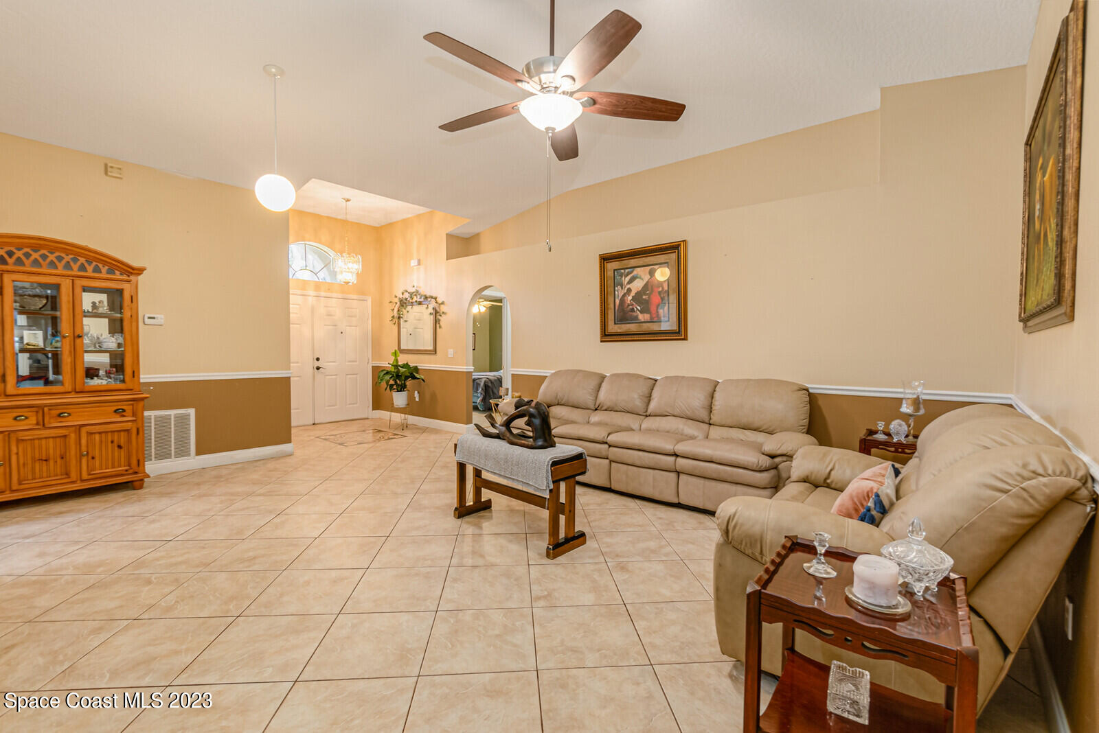 2154 Spring Creek Circle Palm Bay, FL 32905 - Photo 19 of 35 a living room with furniture and kitchen view