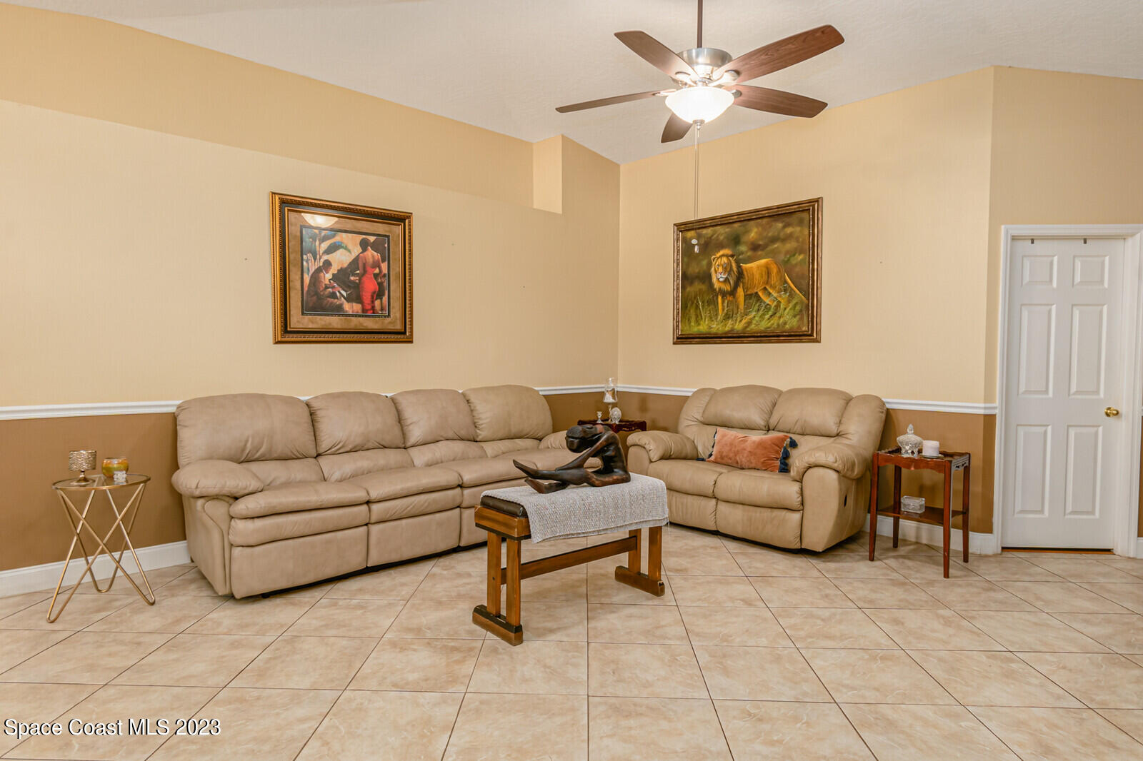 2154 Spring Creek Circle Palm Bay, FL 32905 - Photo 20 of 35 a living room with furniture and a rug