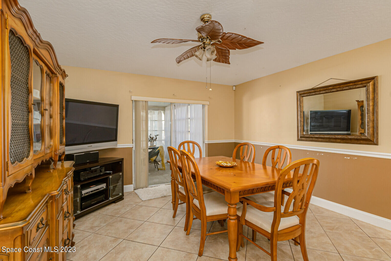 2154 Spring Creek Circle Palm Bay, FL 32905 - Photo 22 of 35 a dining room with furniture and window