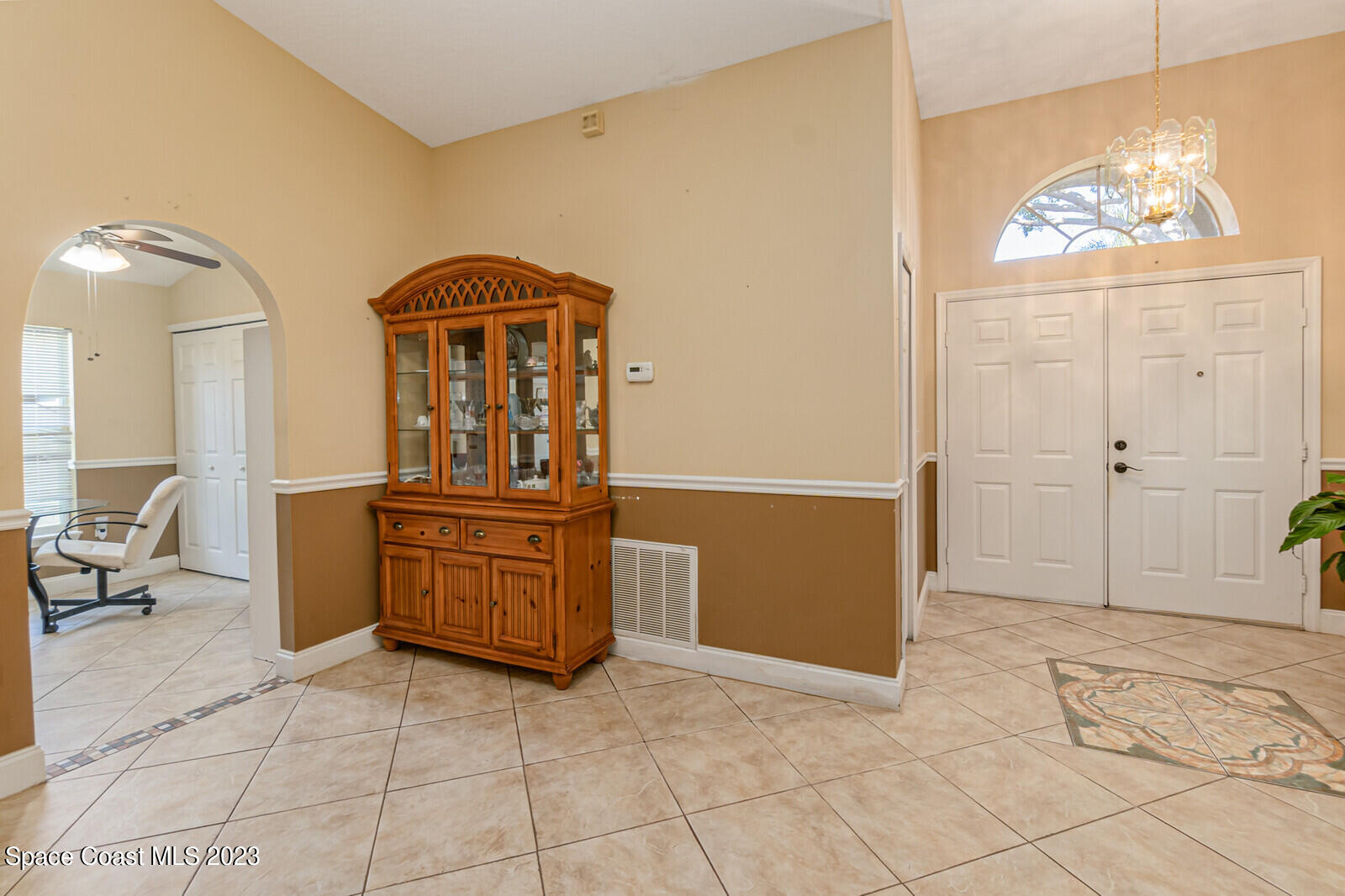 2154 Spring Creek Circle Palm Bay, FL 32905 - Photo 23 of 35 a kitchen with stainless steel appliances a stove a refrigerator and a cabinets