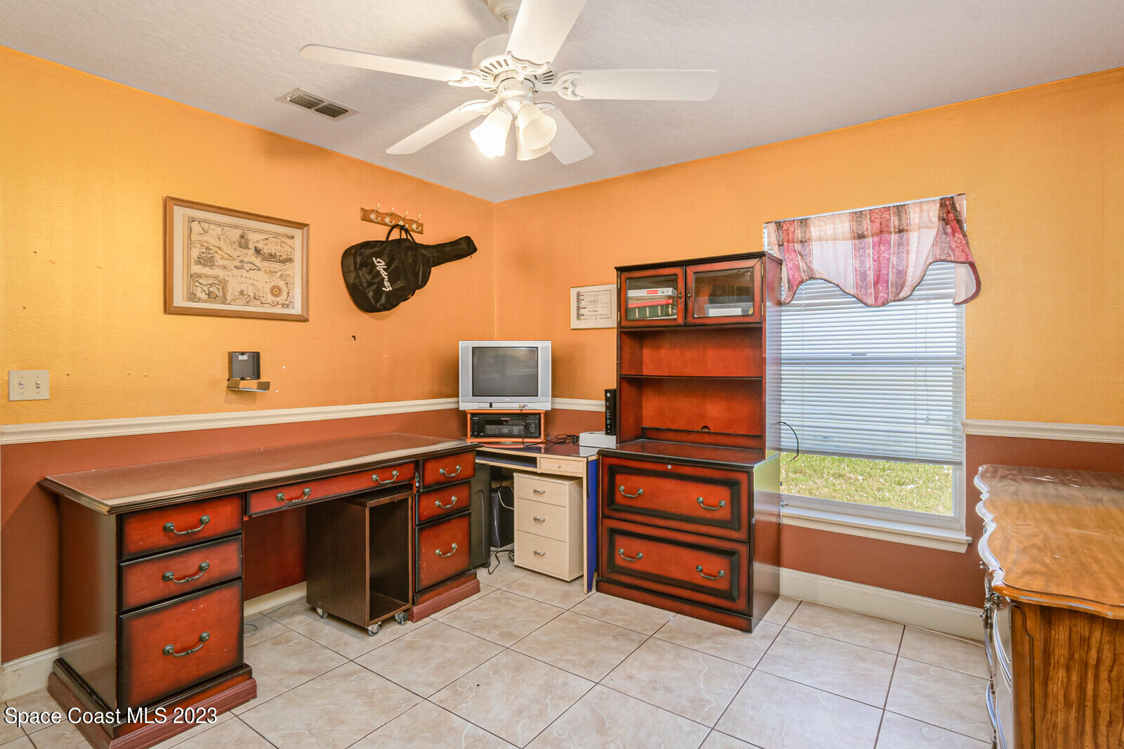 2154 Spring Creek Circle Palm Bay, FL 32905 - Photo 29 of 35 a kitchen with a stove and a microwave