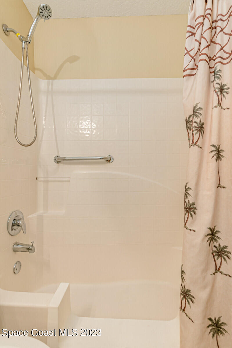 2154 Spring Creek Circle Palm Bay, FL 32905 - Photo 31 of 35 a bathroom with a shower