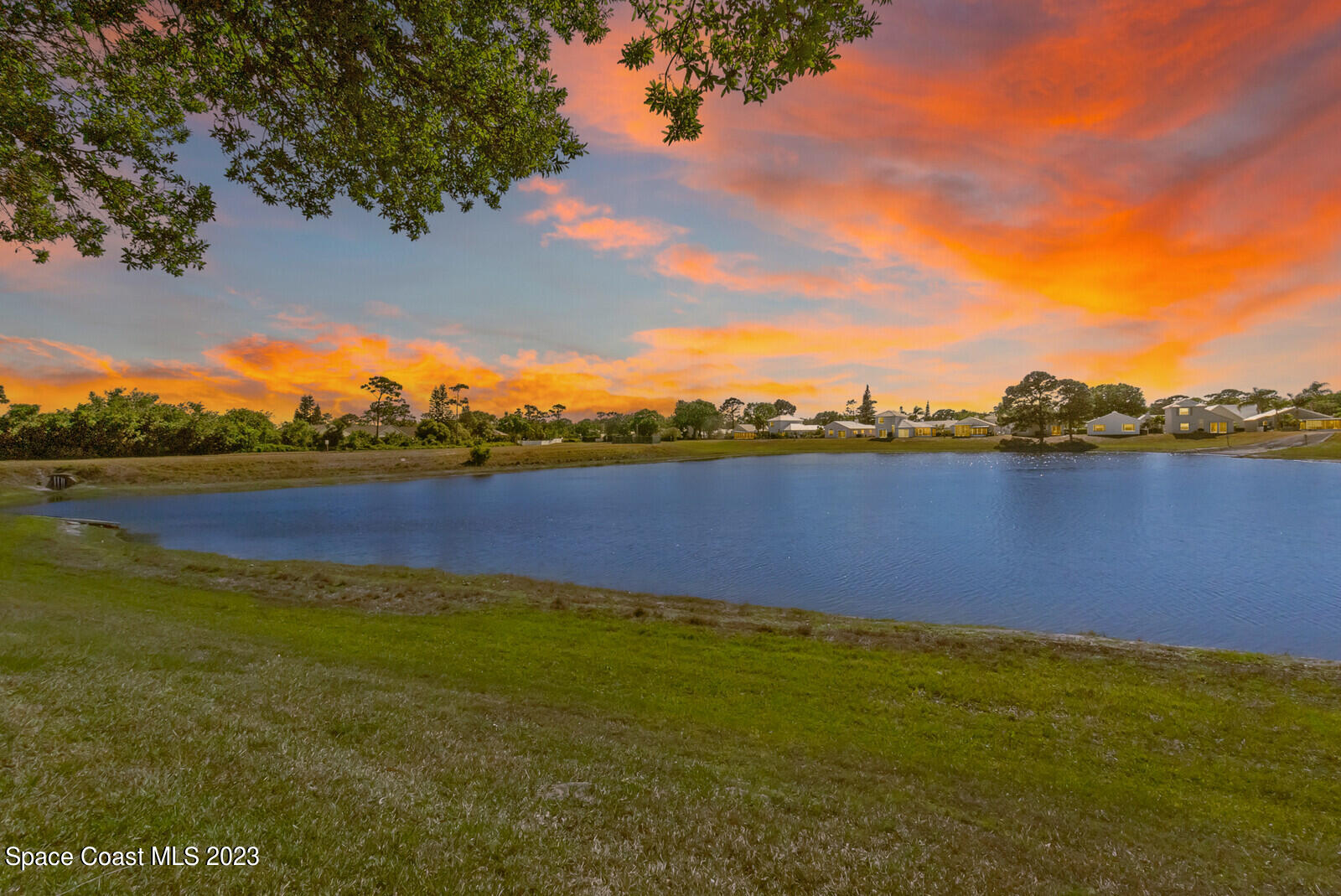 2154 Spring Creek Circle Palm Bay, FL 32905 - Photo 6 of 35 a view of a lake with houses in the back