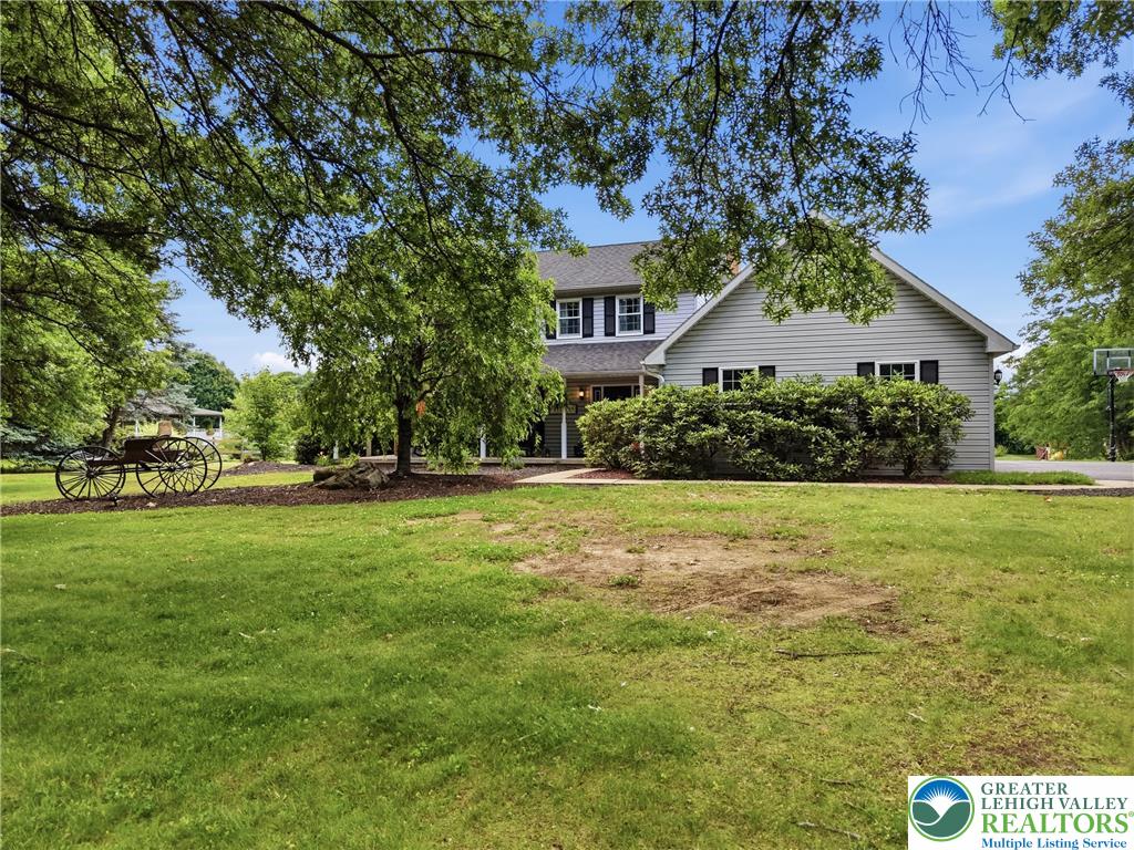 890 Lahr Road Nazareth, PA 18064 - Photo 63 of 71 A classic facade with mature trees and a sweeping lawn creates an inviting welcome.