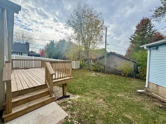 a view of a bench in the backyard