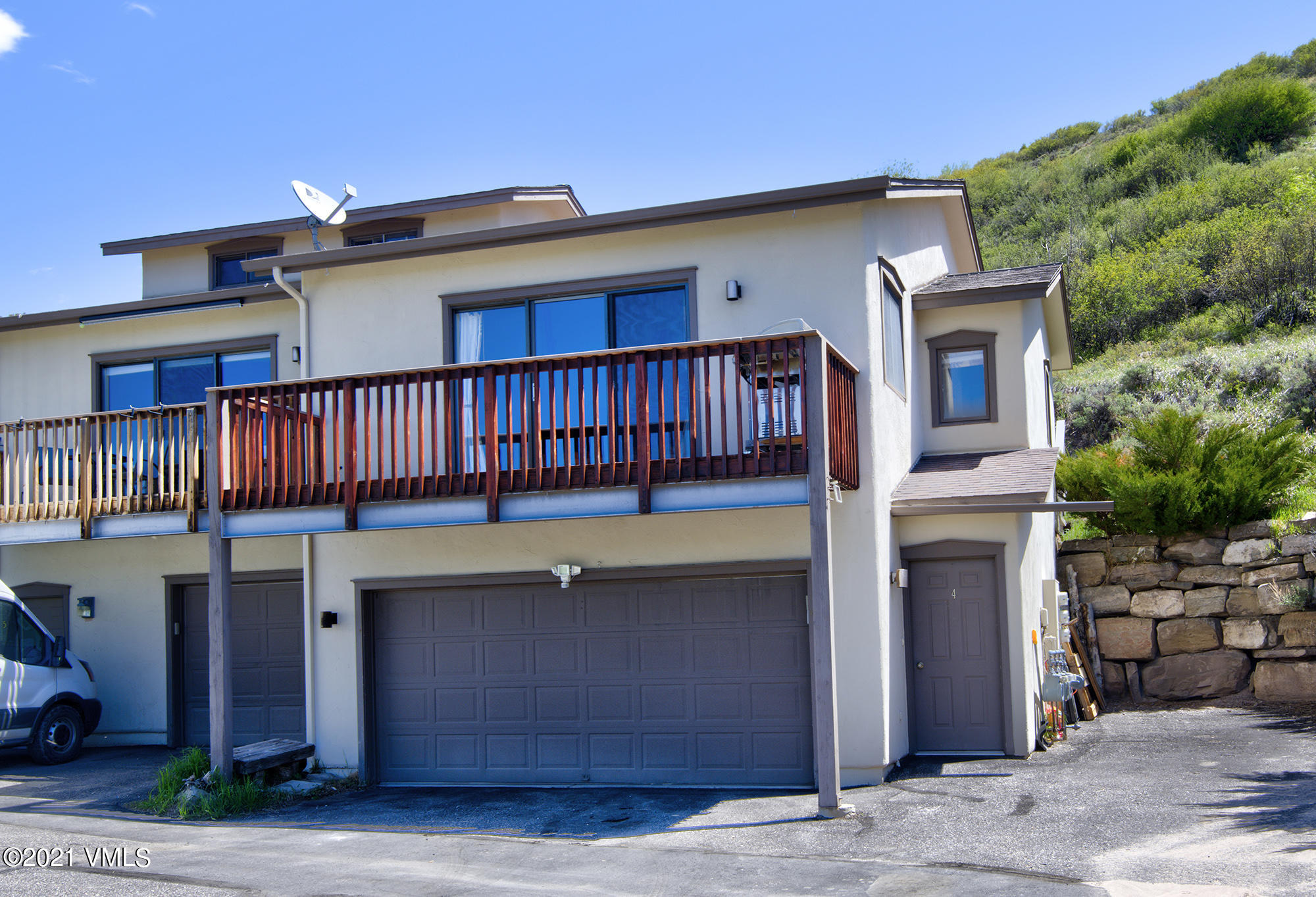 1066 West Wildwood Road, Unit D Avon, CO 81620 - Photo 1 of 21 a front view of a house with entryway