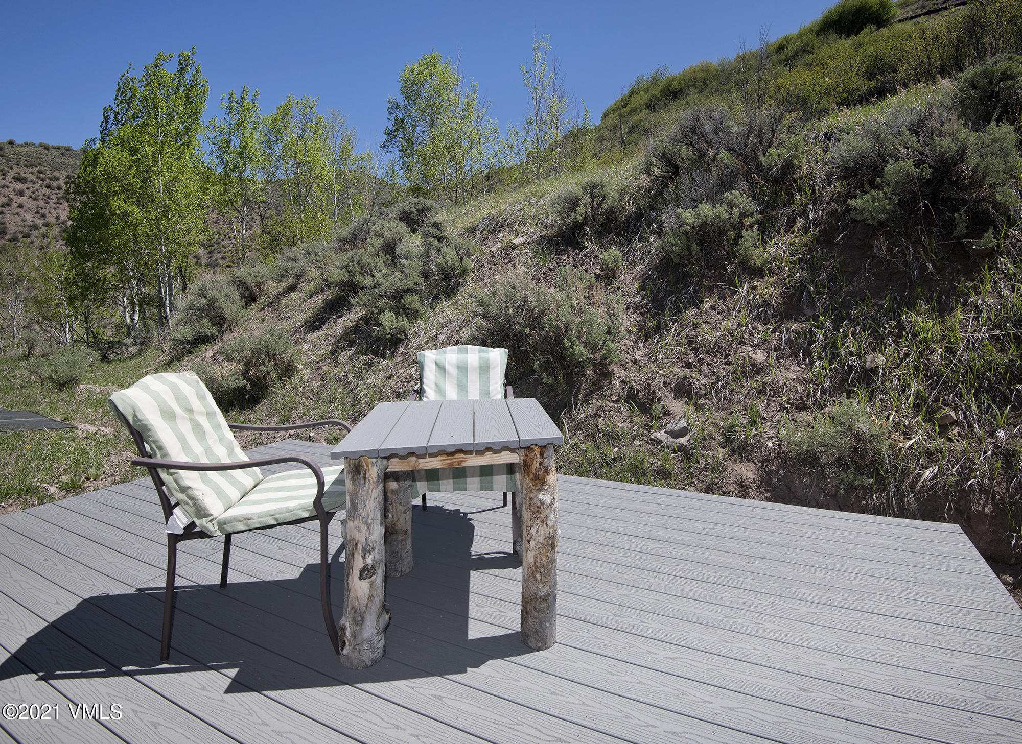 1066 West Wildwood Road, Unit D Avon, CO 81620 - Photo 16 of 21 a wooden bench sitting on top of a wooden floor