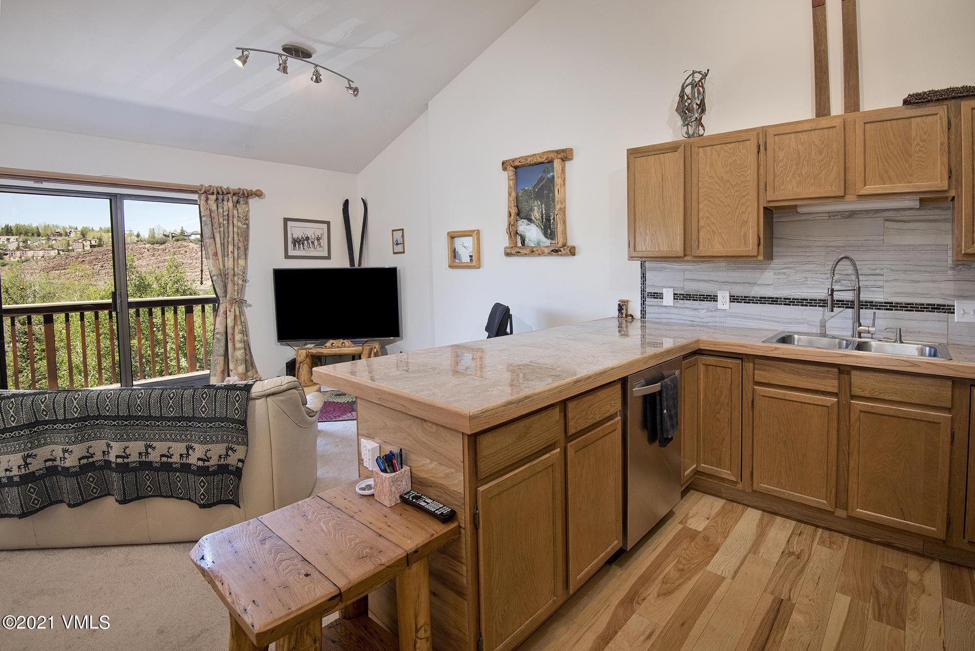 1066 West Wildwood Road, Unit D Avon, CO 81620 - Photo 2 of 21 a kitchen with a stove a sink and a refrigerator