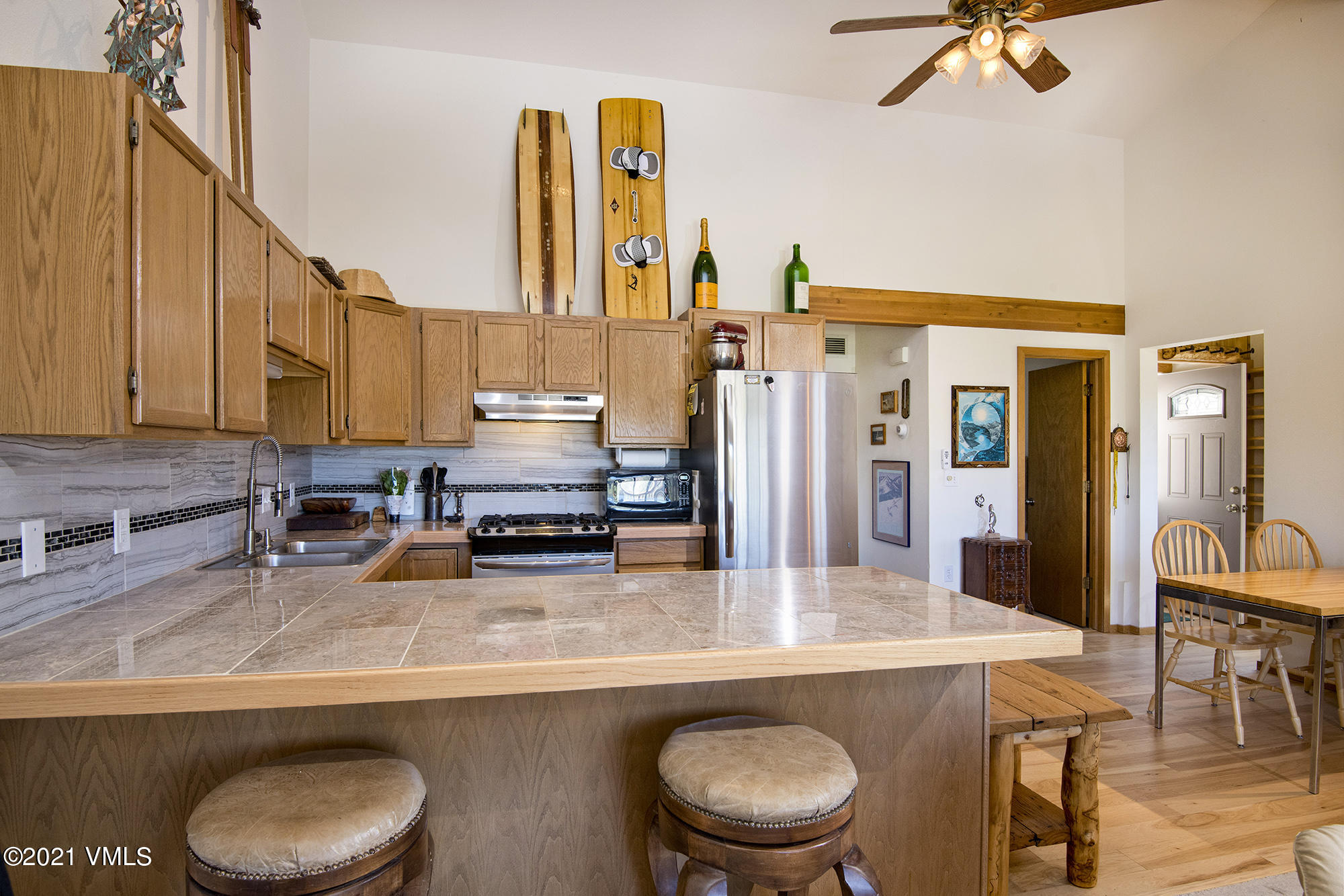 1066 West Wildwood Road, Unit D Avon, CO 81620 - Photo 3 of 21 a kitchen with a sink appliances and cabinets