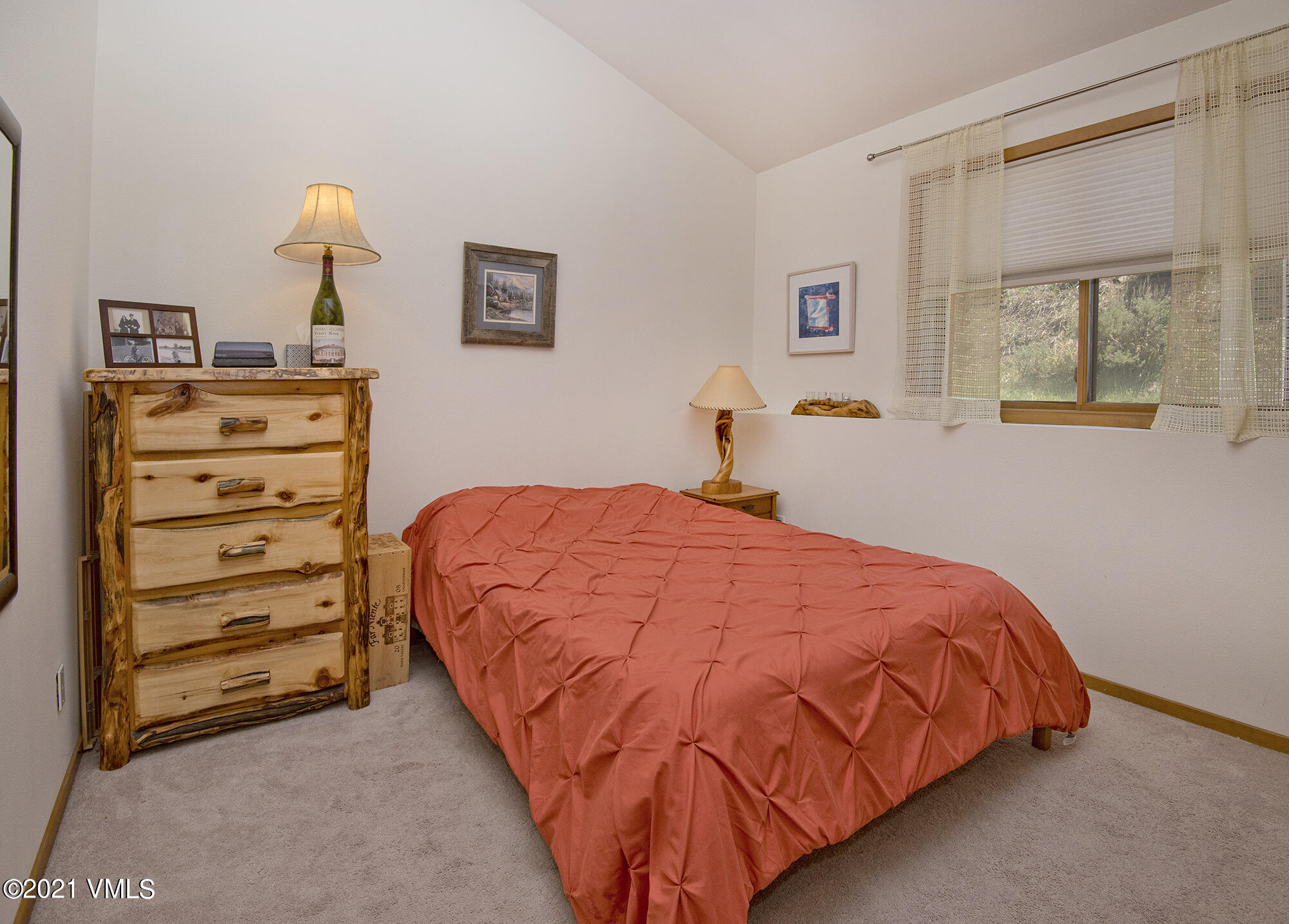 1066 West Wildwood Road, Unit D Avon, CO 81620 - Photo 9 of 21 a bedroom with a bed and a window
