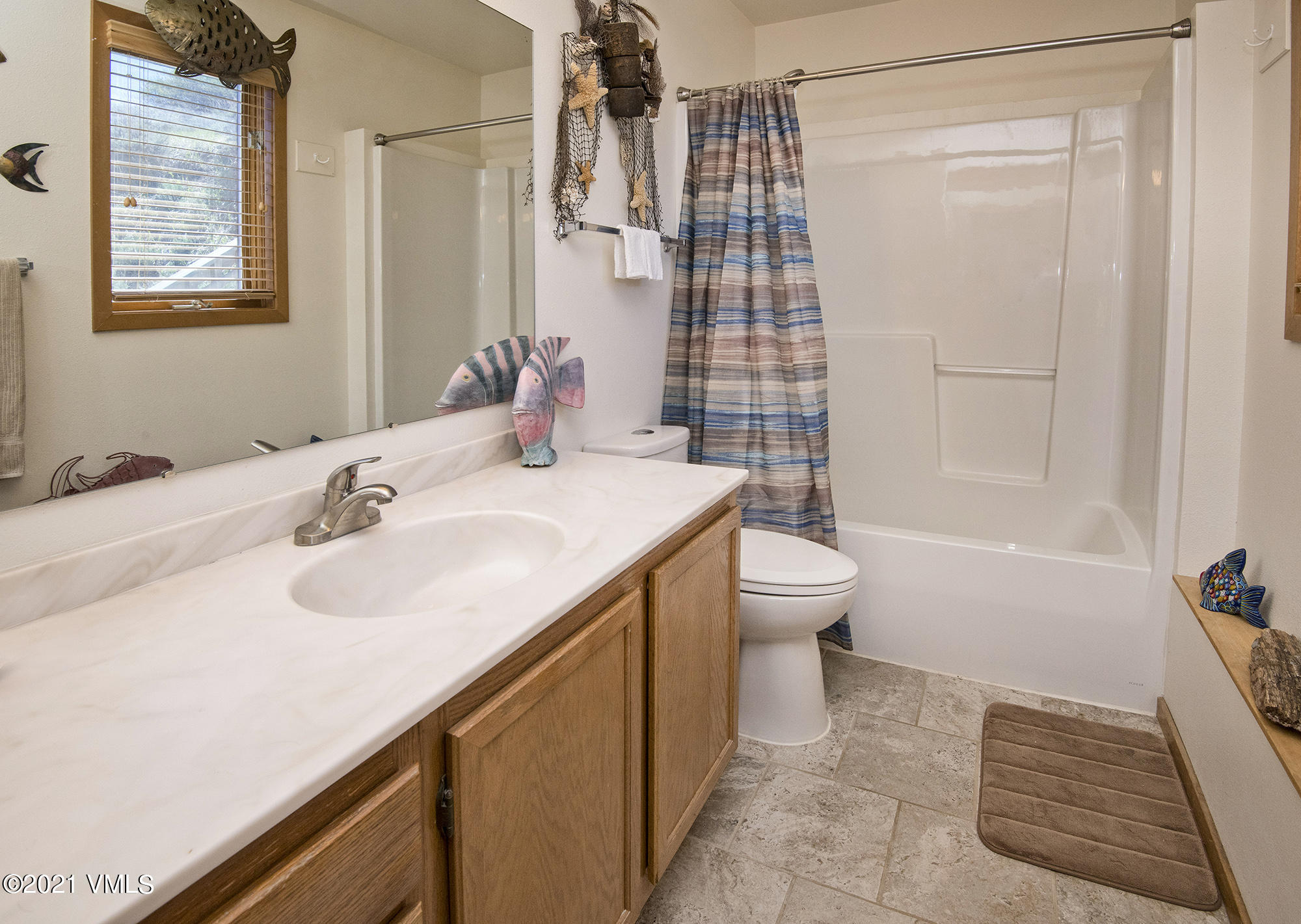 1066 West Wildwood Road, Unit D Avon, CO 81620 - Photo 10 of 21 a bathroom with a sink and a mirror