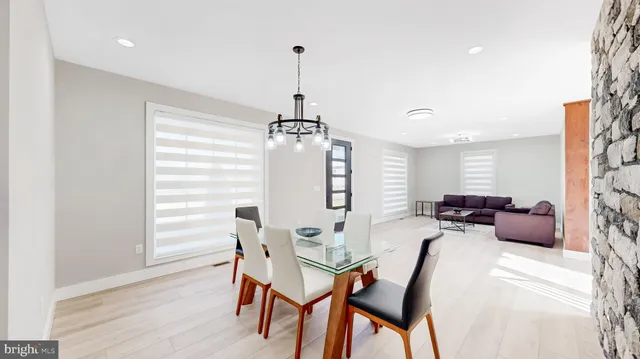 a kitchen with stainless steel appliances kitchen island granite countertop a sink and cabinets