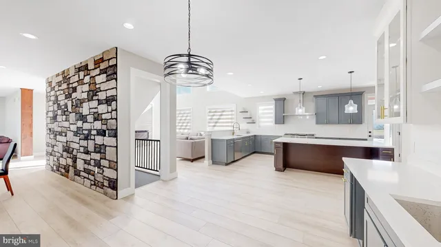 a kitchen with stainless steel appliances a refrigerator and stove